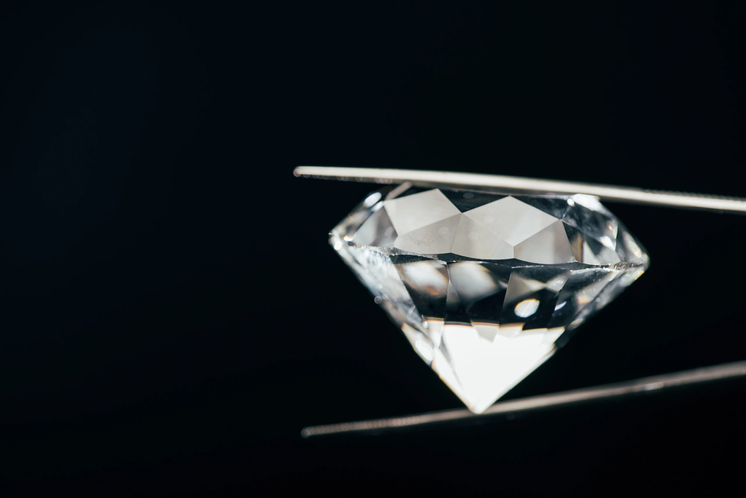 transparent pure sparkling diamond in tweezers iso 2024 11 18 02 46 49 utc 1 - Crystal Laser Engraving